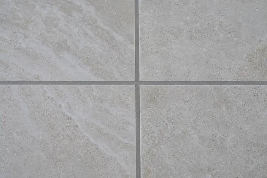 Of freshly color-sealed grout lines looking uniform between tiles
