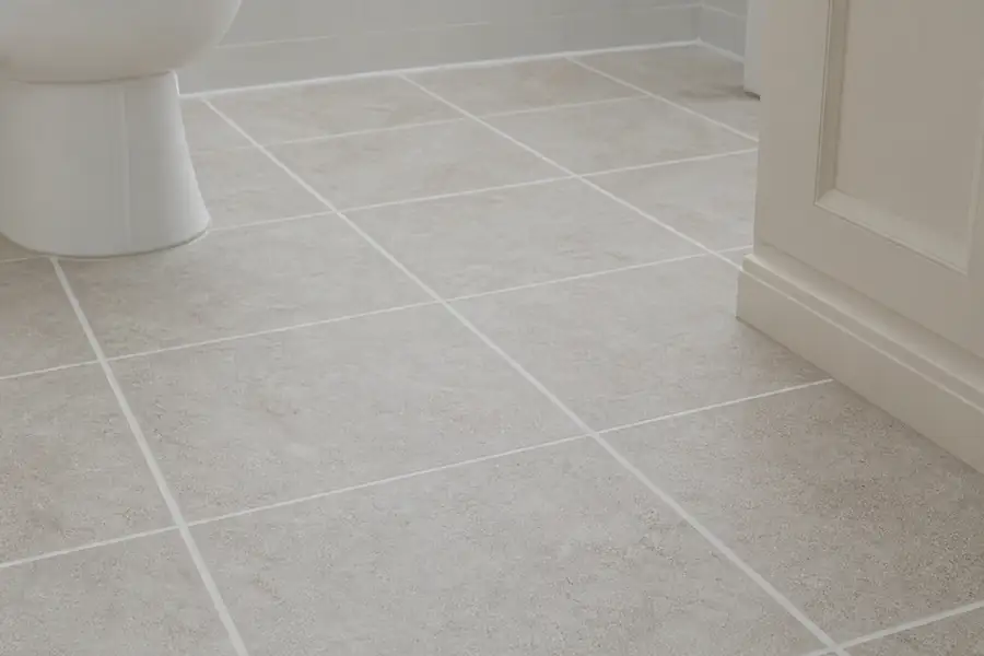 Bathroom floor tiles with crisp clean grout lines in morning light